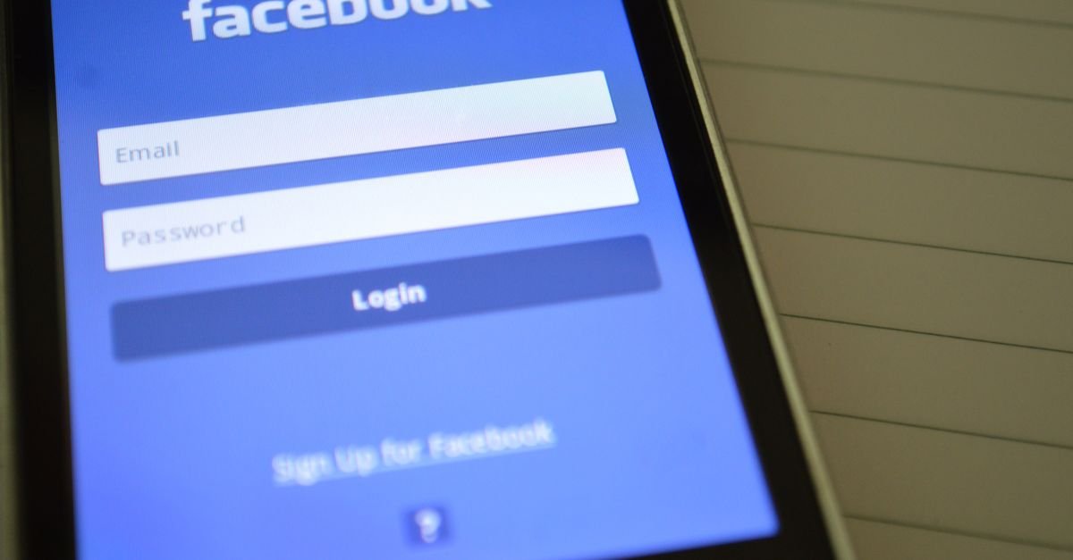 Mobile phone with Facebook login screen, highlighting digital connectivity and social media use.